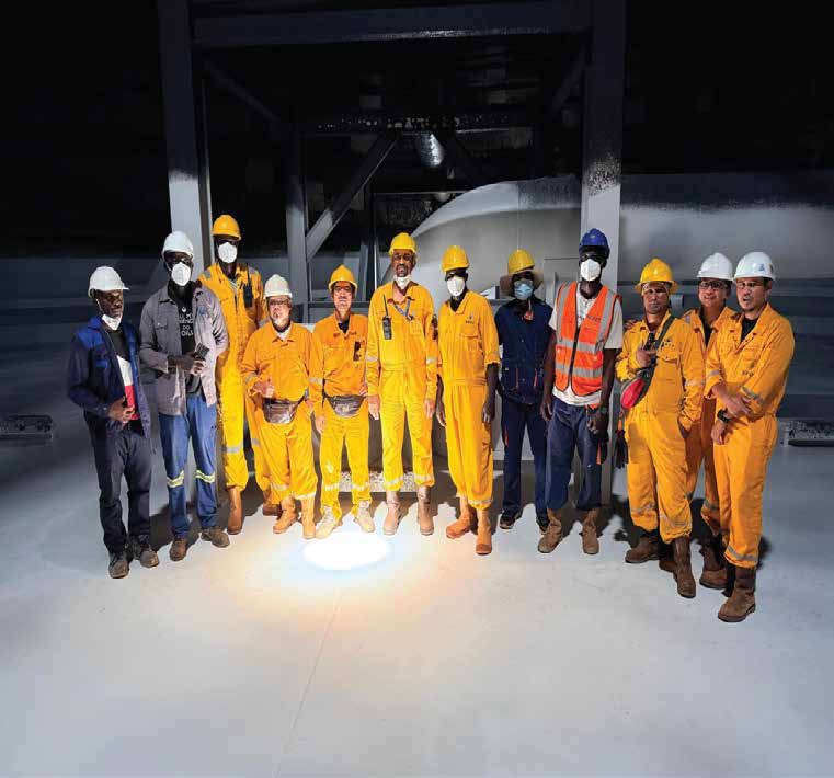 SWAED crew in coveralls and hard hats on a night shift